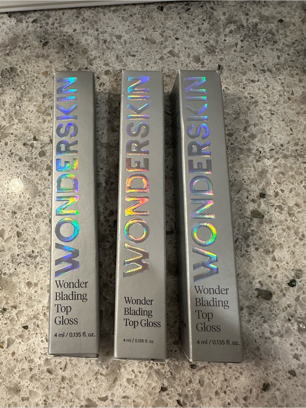 Wonderskin Wonder Blading Top Gloss in shades Red, Gold & Silver Glitter